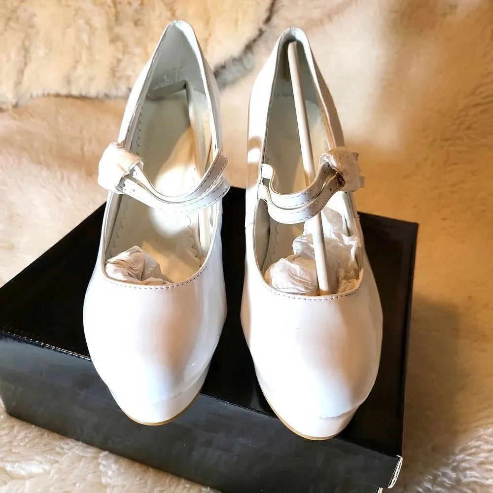 White patten Mary Jane's, with light pink platforms size 5/6